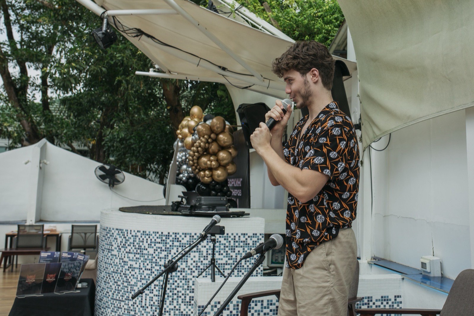 Vsevolod Gurkov on stage with a microphone