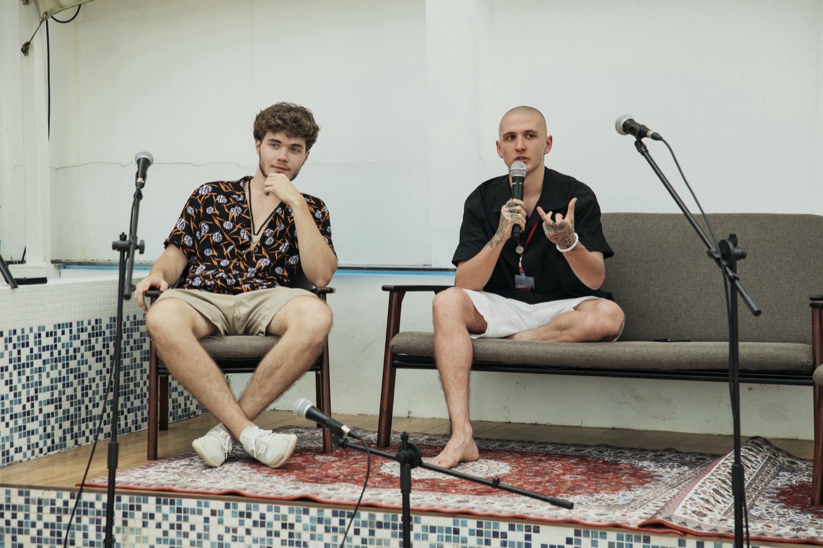 Vsevolod Gurkov and a guest speaker seated on stage