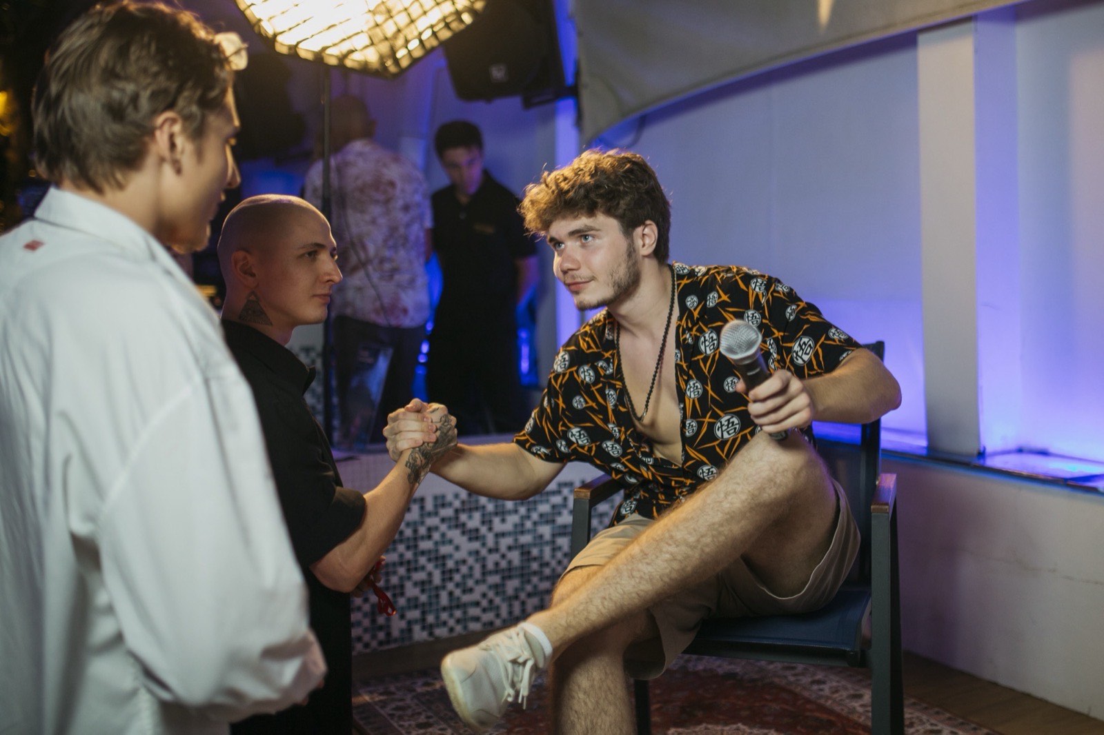 Vsevolod Gurkov with guests at a table in the evening
